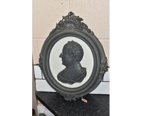 A CAST IRON PORTRAIT WALL PLAQUE, bearing a relief moulded side profile of Prince Albert, within a deep oval frame with fruit