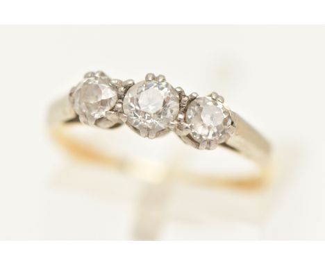 A YELLOW METAL DIAMOND THREE STONE RING, set with three old cut diamonds, each in a double claw setting, estimated total diam