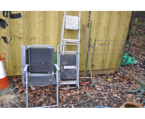 A PAIR OF FOLDING GARDEN CHAIRS, three step ladders, a wine rack, a sun lounger etc (10)