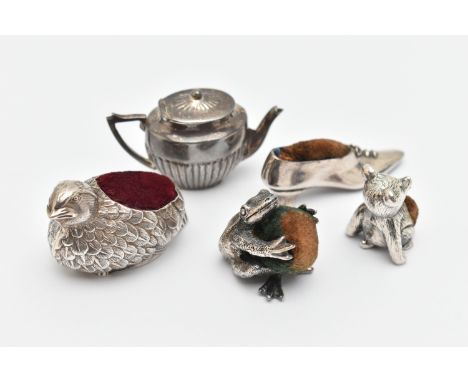 FOUR MODERN  PIN CUSHIONS AND A MINIATURE TEAPOT, to include a white metal chick stamped 925, a frog stamped 925, a teddy sta