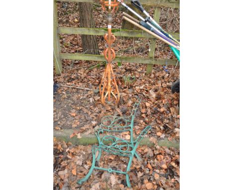 AN ARTS AND CRAFTS STYLE WROUGHT IRON ADAPTED GAS LAMP, 120cm high, and a pair of modern cast iron bench ends (3) Condition r