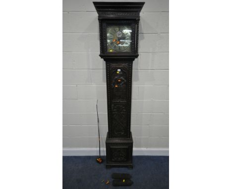 A GEORGIAN OAK CASED EIGHT DAY LONGCASE CLOCK, with intricate carvings all over, the square glass door enclosing an 11 inch b