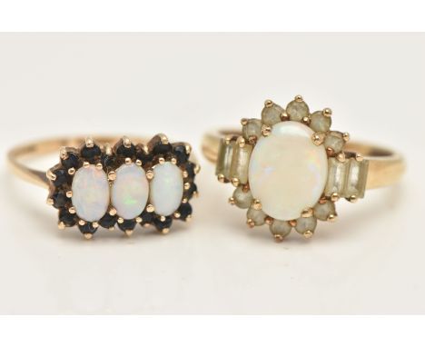 TWO 9CT GOLD OPAL SET RINGS, the first an oval cluster ring set with an oval cut white opal cabochon, four claw set within a 