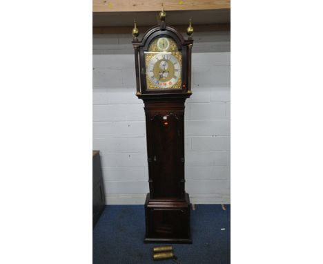 A GEORGIAN MAHOGANY LONGCASE CLOCK, the arched hood with three brass finials, the arched glass door enclosing a 12 inch brass