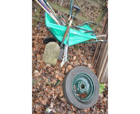 A MODERN LEAF BARROW WITH TOOLS INSIDE, including a tree popper, kneeler, a wheel with tyre, etc