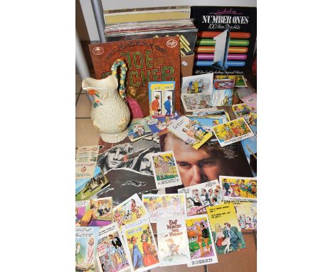 ONE BOX OF L.P VINYL RECORDS AND NOVELTY POSTCARDS, to include twenty nine L.P records, artists include Status Quo, Joe Cocke