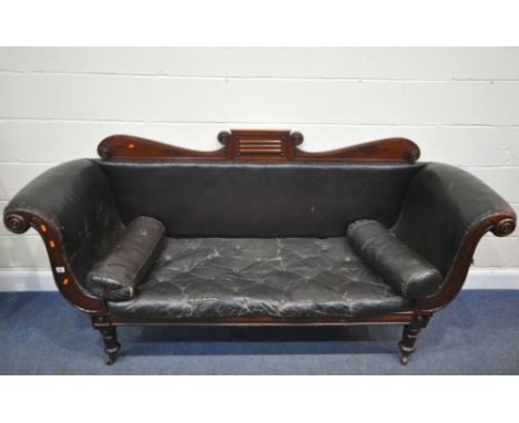 A REGENCY MAHOGANY SOFA, with a scrolled and shaped crest, scrolled armrests, leatherette upholstery, raised on hexagonal tap
