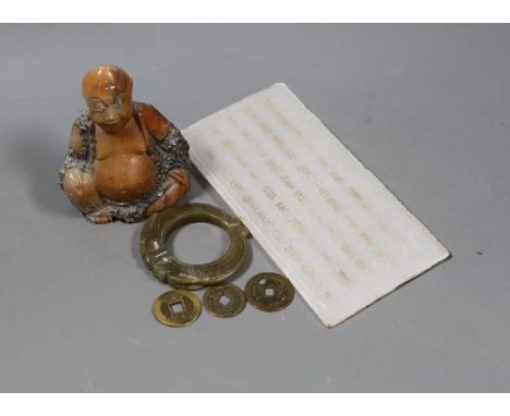 Assorted Chinese items to include a jade ring, coins, a stone inscribed plaque, 15.8 x 8cm and a soapstone figure