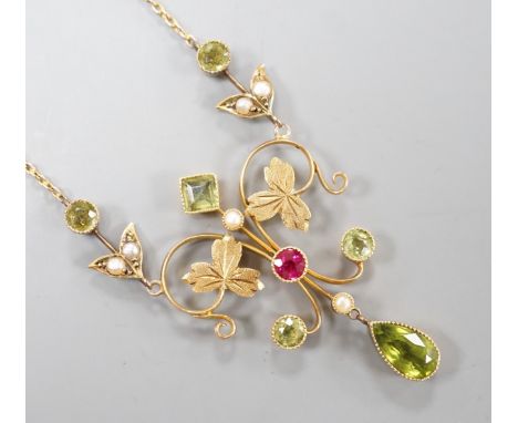 An Edwardian 15ct, peridot, seed pearl and ruby set drop pendant necklace, 46cm, gross weight 6.9 grams.