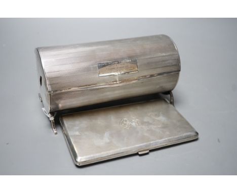 A George V engine turned cylindrical twin compartment cigarette box, with revolving cover, London, 1928, 17.1cm, with engrave