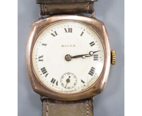 A gentleman's 1920's 9ct gold Rolex manual wind wrist watch, on associated strap, with case back inscription.