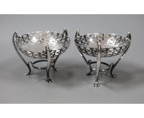 A pair of Edwardian pierced silver bon bon dishes, on raised tripod supports, E.S. Barnsley &amp; Co, Birmingham, 1906, heigh
