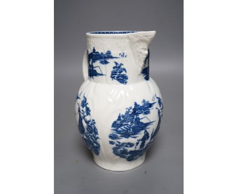 A Caughley baluster mask jug of cabbage leaf moulded shape, printed in underglaze blue with five landscapes of the Fisherman,