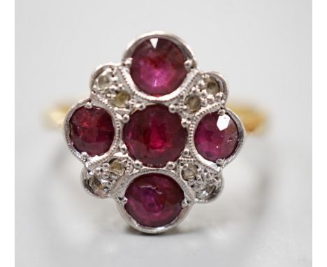 A 1920's 18ct and plat and five stone ruby set quatrefoil shaped ring, with diamond chip spacers, size L, gross weight 3.5 gr