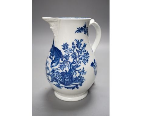 A Caughley baluster mask jug printed in underglaze blue with the 'parrot pecking fruit', 18.5cms high