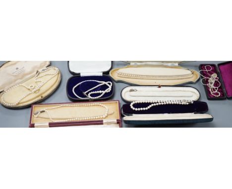 Six assorted single strand graduated cultured pearl necklaces, with marcasite or paste set clasps, longest 64cm and two small