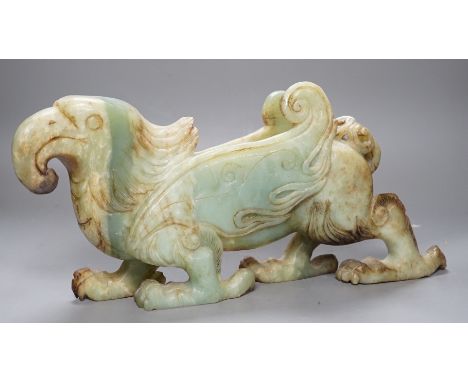 A large Chinese bowenite jade figure of a winged mythical beast, 46cm long