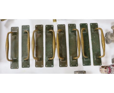 A set of 8 large bronze door handles, 30cm long