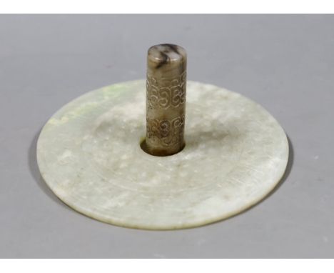 A Chinese archaistic white and black jade cylinder bead, 5.8 cm, boxed and a Chinese archaistic jade large bi disc, 13 cm dia