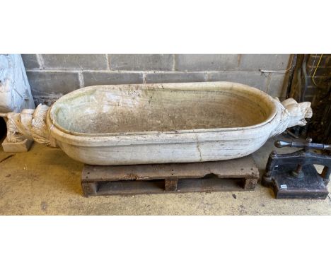 A South East Asian carved stone trough with twin lion mask decoration, width 184cm, depth 61cm, height 30cm