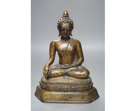 A Himalayan bronze figure of Buddha Shakyamuni, 25cm