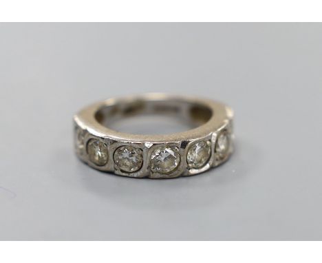 A modern 18ct white gold and seven stone diamond set half hoop ring, size J/K, gross weight 5.8 grams, each stone diameter ap