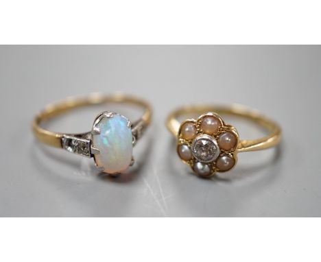 An 18ct and Plat, split pearl and diamond cluster set ring, size F/G and a similar white opal set ring with diamond set shoul