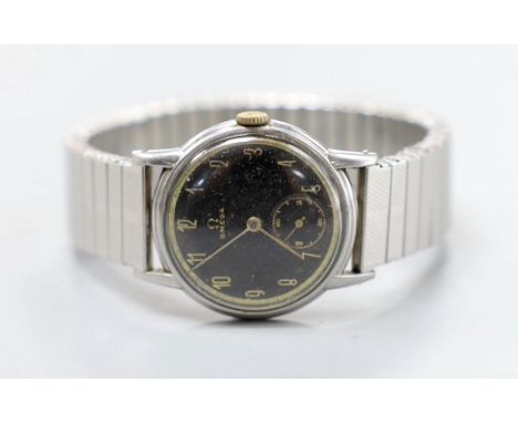 A gentleman's stainless steel Omega manual wind wrist watch, case diameter 29mm, with black Arabic dial and subsidiary second
