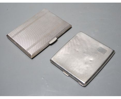 Two engine turned silver cigarette cases, largest 11.2cm, gross weight 10oz.