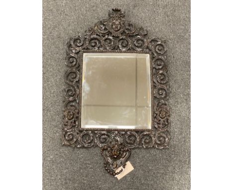 A late 19th century bronze wall mirror, 68 x 42 cm