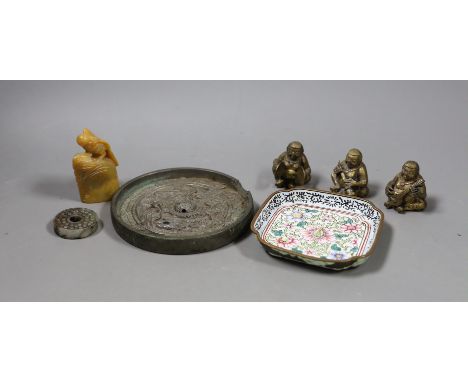 A group of assorted Chinese items to include jade bi disc, a Canton enamel dish, a bronze mirror, a soapstone seal, etc.