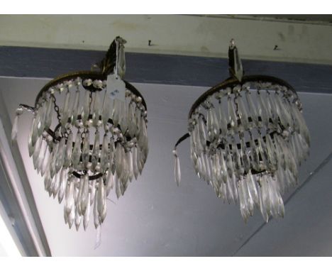 A pair three tier glass ceiling light