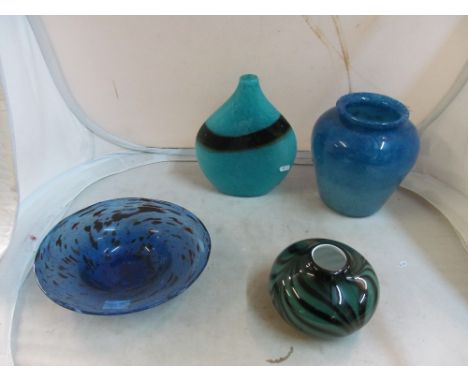 A blue art glass vase, two other vases and a plate