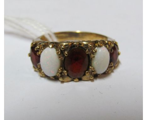 A 9ct opal and red five stone ring 3.3gm, size K