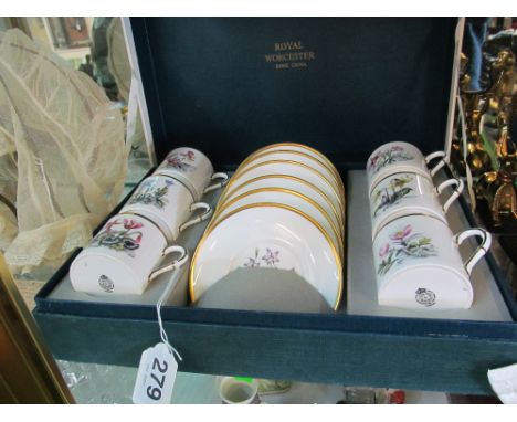 A Royal Worcester set of six cups and saucers decorated different flowers (boxed)