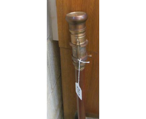 A modern compass top brass walking stick