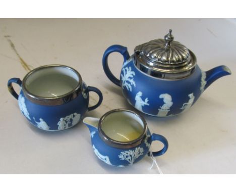 A Wedgwood Jasperware three piece teaset plated rims and lid (chip to spout) and sucrier (handle damaged)