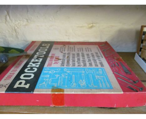 A Guillows model Hellcat, a book on war planes, a POW model plane, another plane and box of Pocket Tools and some loose Pocke