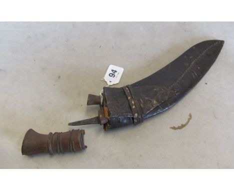 A curved dagger in leather scabbard (a/f)