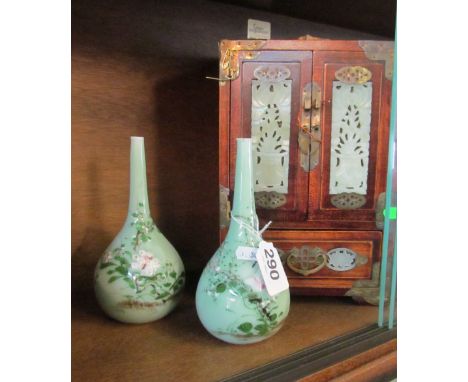 A pair of Chinese Celadon vases and an oriental cabinet with jade panels