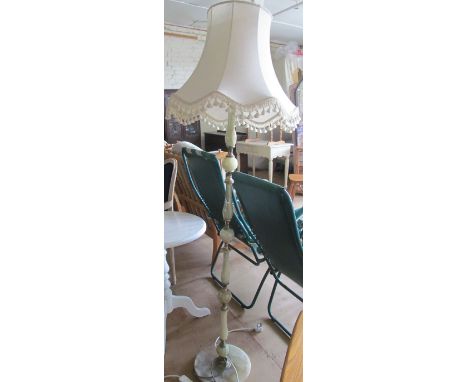 An onyx and gilt standard lamp
