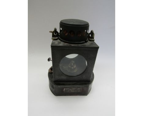 A railway signal lamp interior with brass burner, stamped NORWICH CITY STATION &amp; M&amp;GN JR on other side