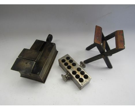 Two vintage brass powder sizing tools and a suppository mould 