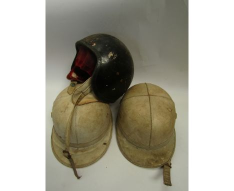 Three vintage motorcycle helmets 