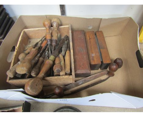 A box of vintage screwdrivers, draw knives, sharpening stones etc 