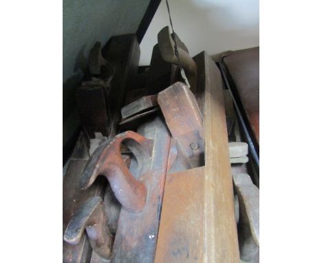 A vintage suitcase containing various block planes 