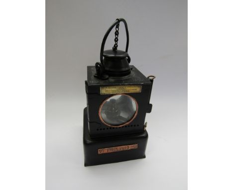 An LNER signal lamp interior with brass burner, copper stamped plaque VICTORIA YARD BOX