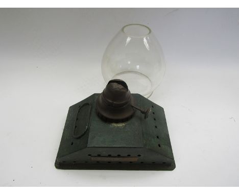 A railway station oil lamp reservoir stamped Walsingham and a glass globe shade