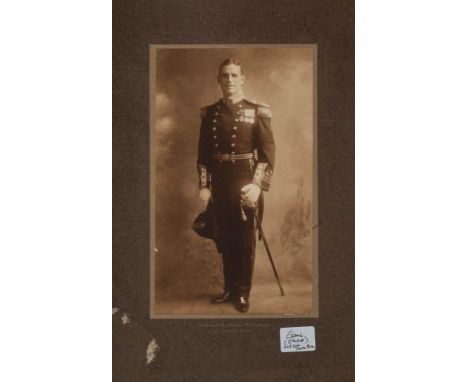 A signed full length photograph portrait of Expedition member Edward Evans in Royal Navy Uniform by Florence C Vandamin, 26 V