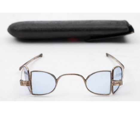 A pair of late 18th/early 19th century white metal framed 'Railway' spectacles: with double 'D' shaped blue glass lenses and 